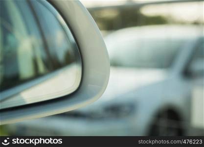 Looking into the outside mirror of a car