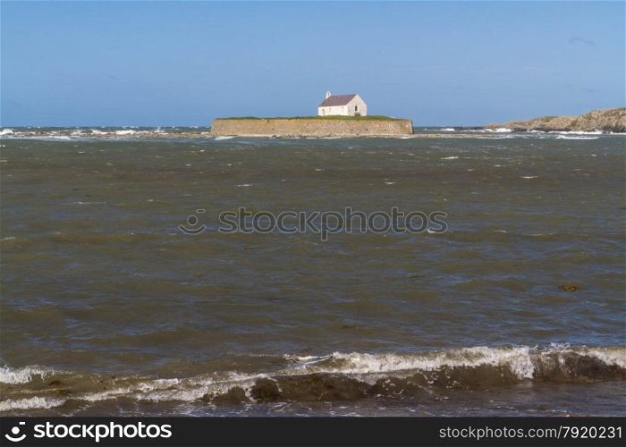 Looking out to see at high tide at St Cwyfan?s Church, the Church in the Sea. Llangwyfan, Aberffraw, Anglesey, Wales, United Kingdom, Europe