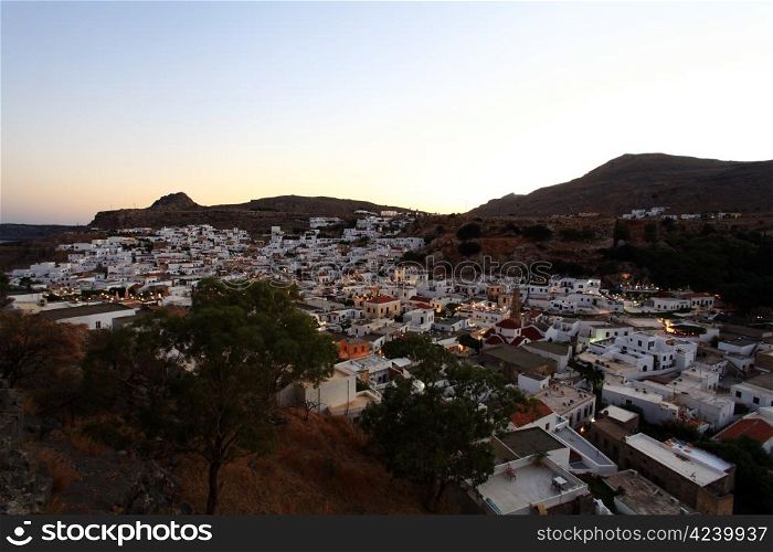 Looking over the rooftops of Lindos village at twilight