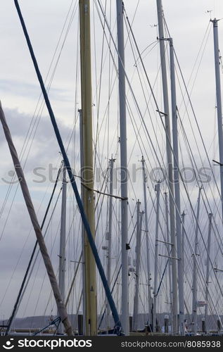 Looking through masts and rigging of yachts.