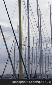 Looking through masts and rigging of yachts.