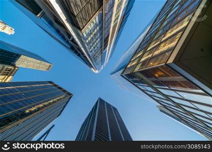 Looking up at business buildings in downtown New York City, USA