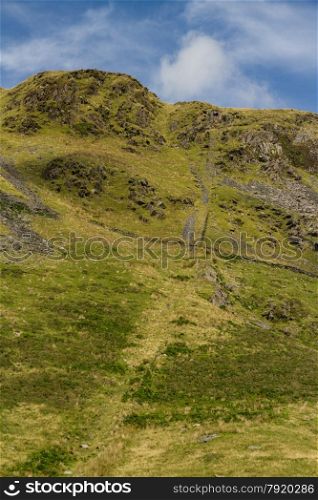 Looking up at huge exit from Rhosydd Slate Mine, longest in the Welsh slate industry. Croesor Valley, Snowdonia National Park, Gwynedd, Wales, United Kingdom.