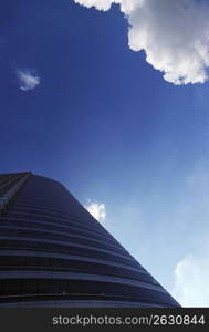 Looking up at office building and sky