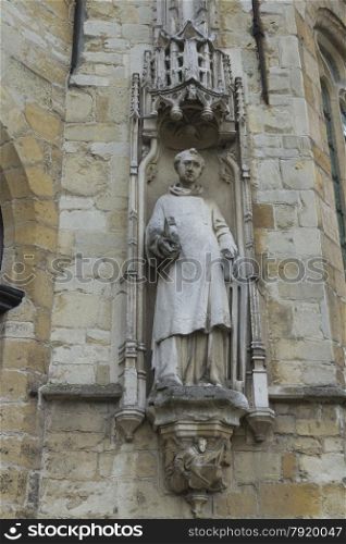 Looking up at statue of Town Hall or Stadhuis. Burg Square, Bruges, West Flanders, Belgium, Europe