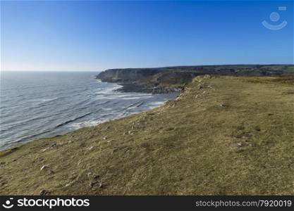 Looking west from Port Eynon Point, towards Overton Cliff and Common Cliff. Gower Peninsula, Swansea, South Wales, United Kingdom.
