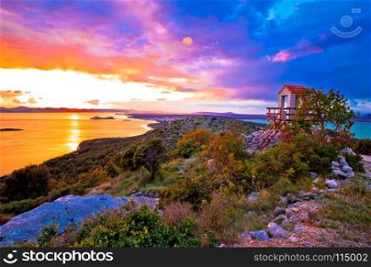 Lookout tower above Pakostane archipelago at golden sunset, archipelago of Dalmatia, Croatia