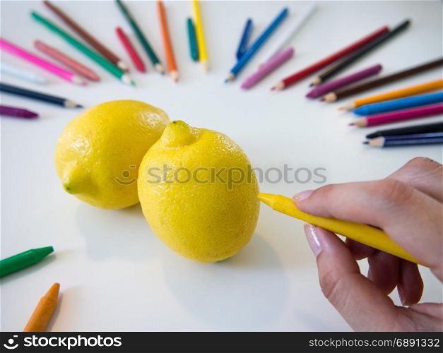 looks like drawing lemons with the colorful crayon