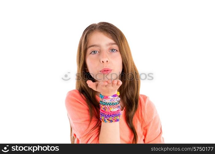 Loom rubber bands bracelets blond kid girl blowing hand on white background