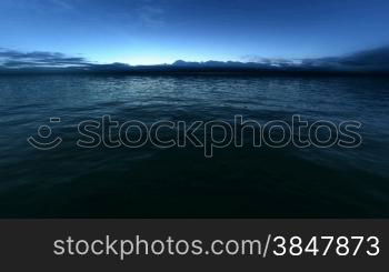 Looped flight over the sunset ocean