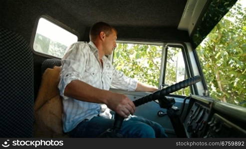 Lorry Driver at the Wheel of Truck