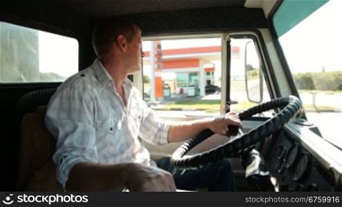 Lorry driver at the wheel of truck