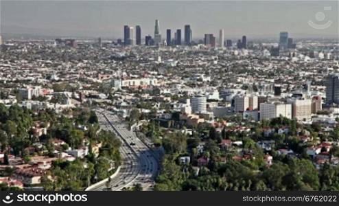Los Angeles city view with traffic on freeway