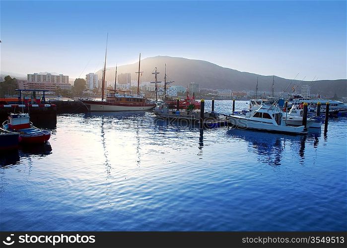 Los Cristianos harbor port sailboat sunrise in Adeje coast Arona Tenerife