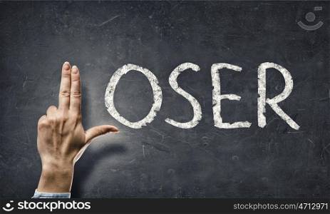 Loser word. Loser word and human fingers instaed of letter L
