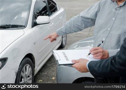 Loss Adjuster Insurance Agent Inspecting Damaged Car. Sales manager giving advice application document considering mortgage loan offer for car insurance
