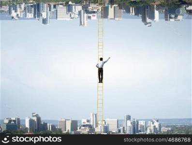 Lost between two worlds. Businessman standing on ladder between two urban realities