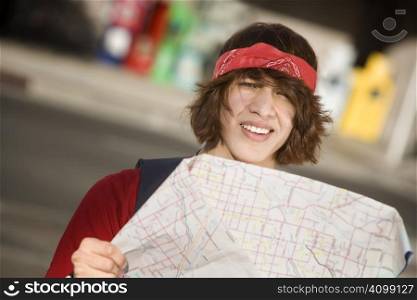 Lost Young Man on the Sidewalk with Map