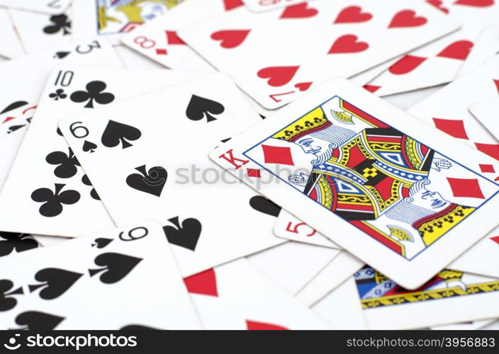 Lot of dusty old playing cards isolated over white background