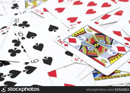 Lot of dusty old playing cards isolated over white background