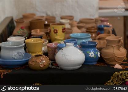 lots of beautifully decorated clay pots. children&rsquo;s crafts. clay art pots