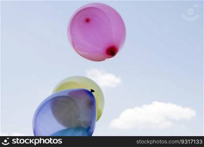 Lots of colorful balloons fly in the sky