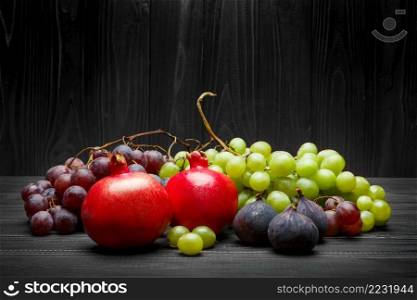 Lots of different organic fruits on wooden background. Lots of different fruits on wooden background