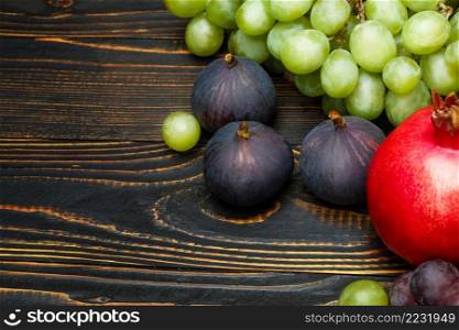Lots of different organic fruits on wooden background. Lots of different fruits on wooden background