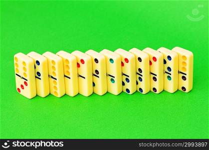 Lots of dominoes on the green background