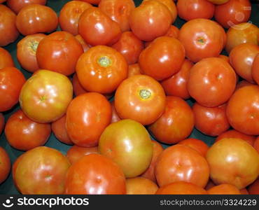 Lots of ripe tomatoes in vegetable stand