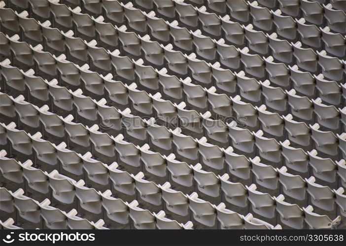 lots of seats in perfect rows in a stadium