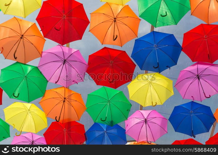 Lots of umbrellas coloring the sky in the city of Agueda, Portugal