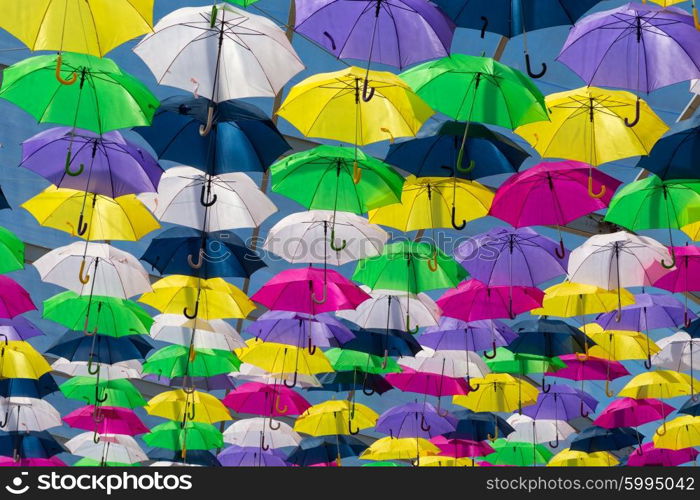 Lots of umbrellas coloring the sky in the city of Agueda, Portugal