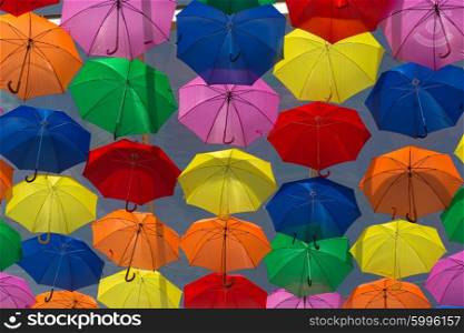 Lots of umbrellas coloring the sky in the city of Agueda, Portugal