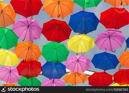 Lots of umbrellas coloring the sky in the city of Agueda, Portugal