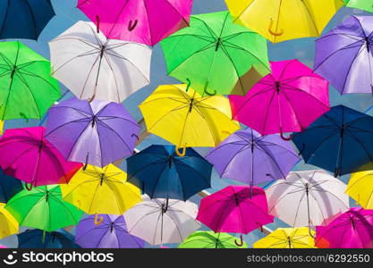 Lots of umbrellas coloring the sky in the city of Agueda, Portugal