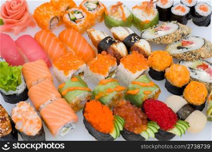 lots of various Japanese sushi and sushi rolls