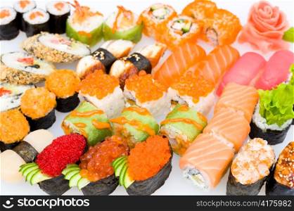 lots of various Japanese sushi, sashimi and sushi rolls