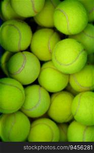 Lots of vibrant green tennis ball pattern background. Full frame sports equipment for training, tournament and competition match. Hobby and recreational activity, shop store advertisement. Lots of vibrant green tennis ball pattern background