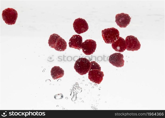 lots raspberries water. High resolution photo. lots raspberries water. High quality photo
