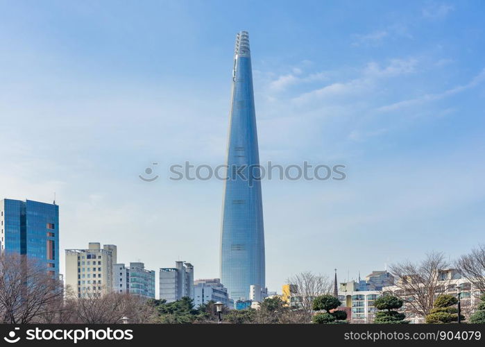 Lotte World Tower and cityscape with cloudy blue sky in winter