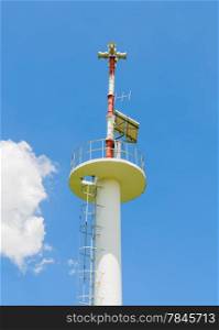 Loudspeaker pole on blue sky