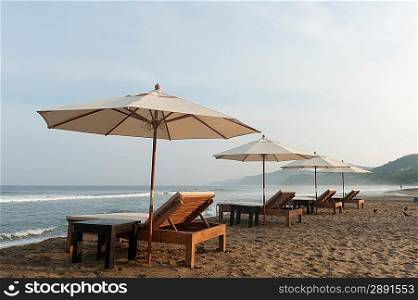 Lounge Chairs and beach umbrellas on the beach, Sayulita, Nayarit, Mexico