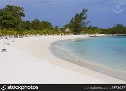 Lounge chairs on the beach, Coral Cay, Dixon Cove, Roatan, Bay Islands, Honduras