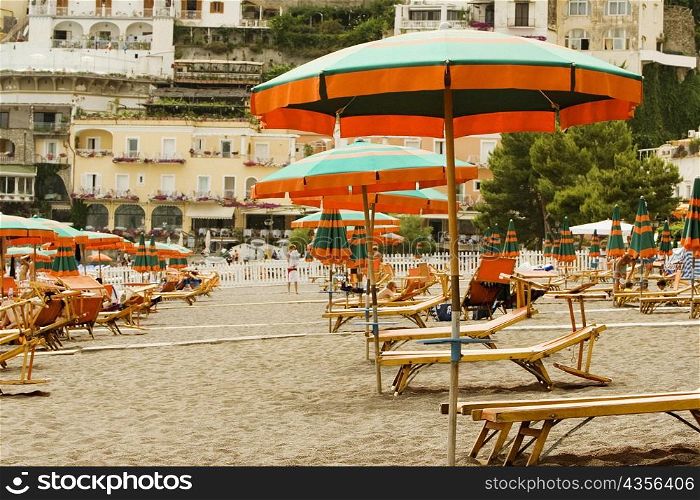 Lounge chairs with beach umbrellas on the beach, Spiaggia Grande, Positano, Amalfi Coast, Salerno, Campania, Italy