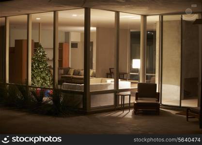 Lounge Decorated For Christmas Viewed From Outside