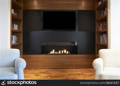 Lounge In Modern Home With TV And Fireplace