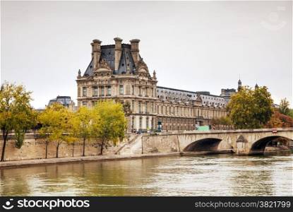 Louvre palace in Paris, France on a cloudy day