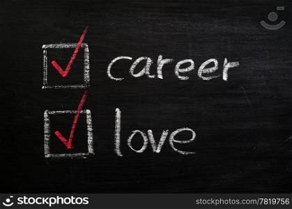Love and career choices with check boxes drawn with chalk on a blackboard
