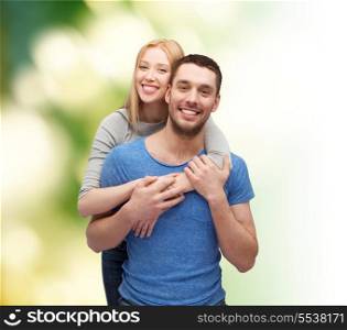 love and family concept - smiling couple hugging
